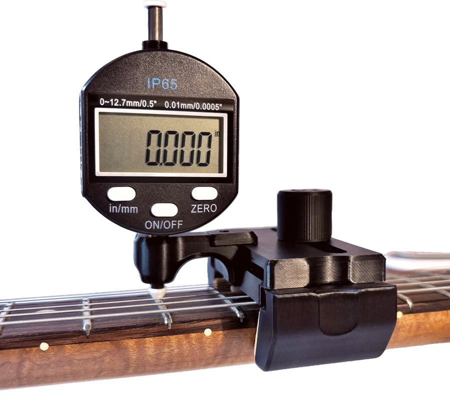 DL Action Finder mounted on a guitar neck measuring string height in playing position